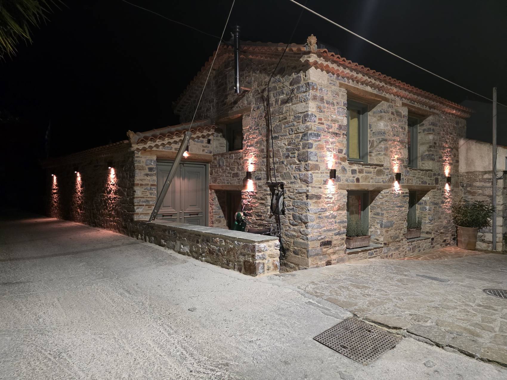 The full length of the house at night