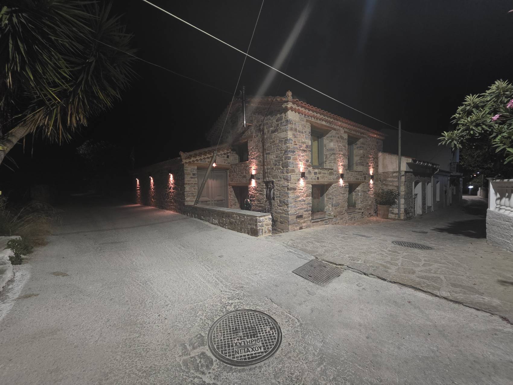 The house at night, seen from the corner of the street