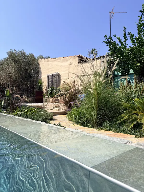 From the pool towards the house, with grasses in between